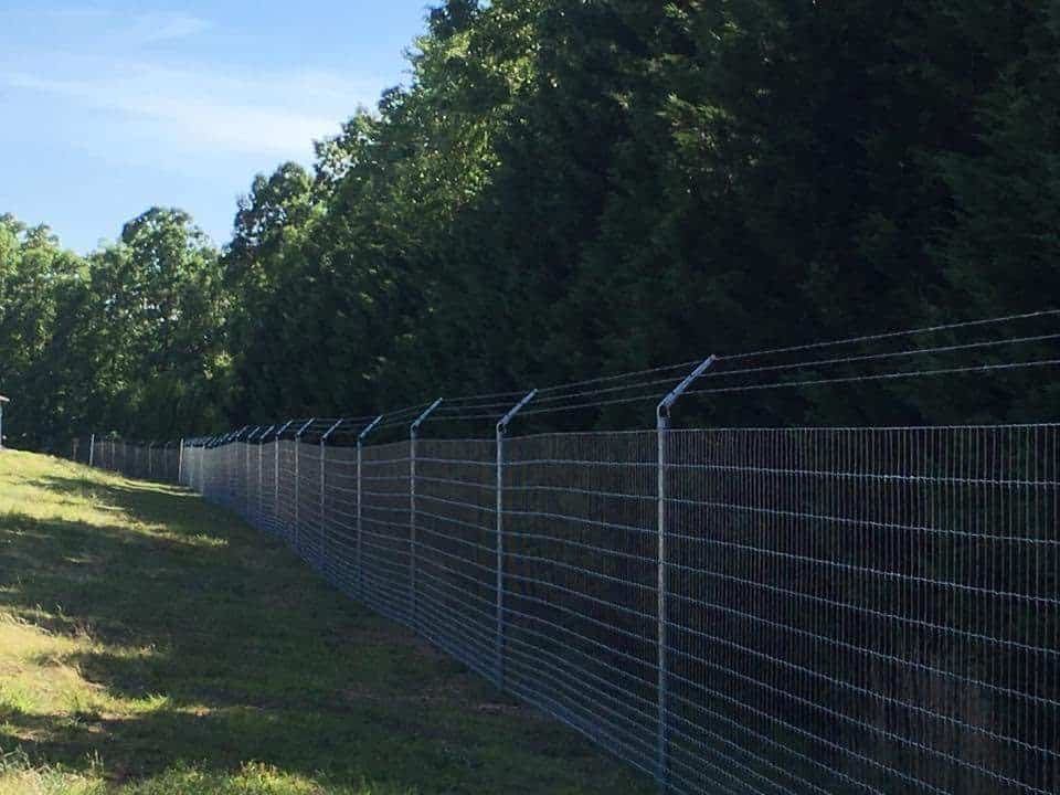 8 ft fence with 3 strand barb arms