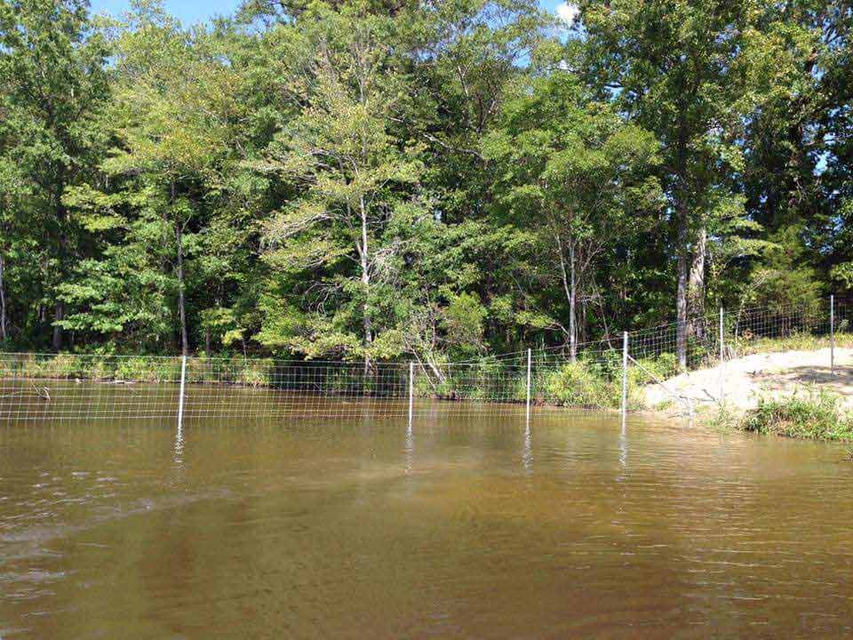 property line crossing, water fence.